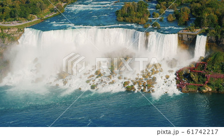 The view from above is the incredible Niagara Falls. View of the Niagara River and American Falls The view from above is the incredible Niagara Falls. View of the Niagara River and American Falls 61742217