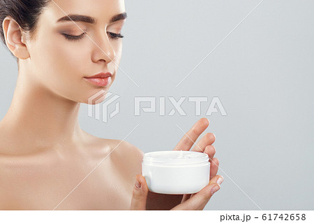Beauty Concept. woman holds a moisturizer in her 61742658