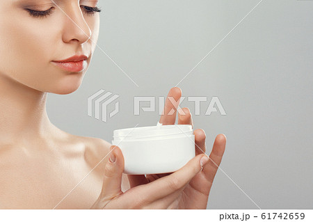 Beauty Concept. woman holds a moisturizer in her 61742659