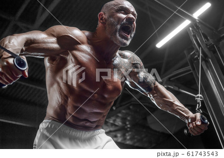 Handsome athletic men pumping up muscles push-ups Handsome athletic men pumping up muscles push-ups 61743543