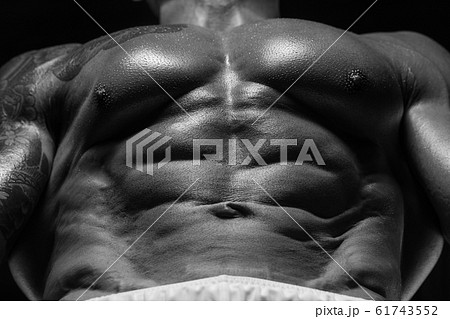 Handsome strong athletic men pumping up muscles 61743552