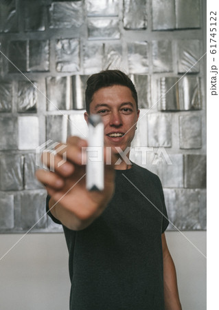 Concept of bad guy with top secret information. Man holding USB momory stick Concept of bad guy with top secret information. Man holding USB momory stick 61745122