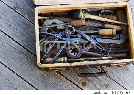 The metal tools in the old suitcase 61745563