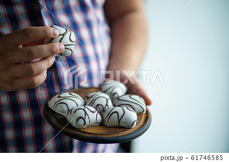 diet breakdown. overweight man eating sweets 61746585