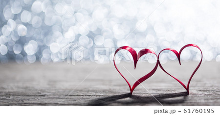 Red ribbon hearts on glitters Red ribbon hearts on glitters 61760195