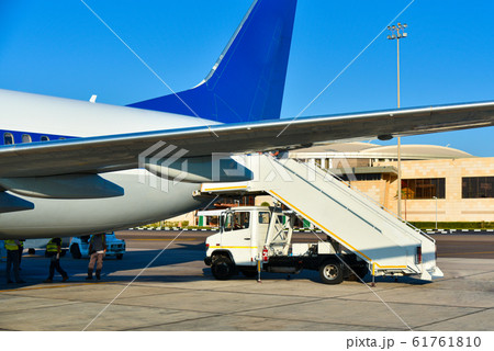 Disembarkation of passengers from an airplane at Disembarkation of passengers from an airplane at 61761810