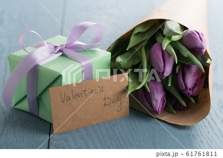 purple tulips with gift box on blue wood background with valentines day card purple tulips with gift box on blue wood background with valentines day card 61761811