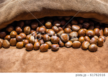 Roasted Chestnuts on brown towel Roasted Chestnuts on brown towel 61762016