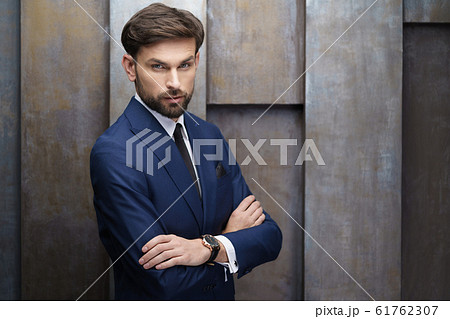 indoor photo of young handsome stylish businessman wearing suit 61762307