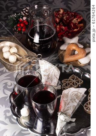 Pomegranate juice in glasses on a tray 61764264