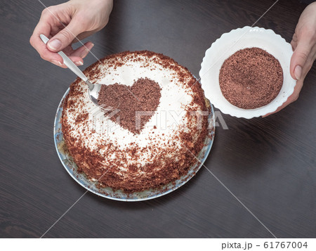 Decorating a cake for Valentines day. Handmade pie Decorating a cake for Valentines day. Handmade pie 61767004