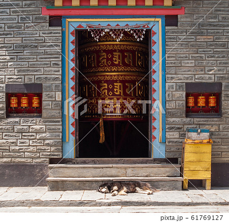 Bouddist Chapel with huge Prayer Wheel inside. Bouddist Chapel with huge Prayer Wheel inside. 61769127