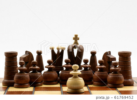 Underdog Concept: One White Pawn Standing Against Black Chess Pieces Underdog Concept: One White Pawn Standing Against Black Chess Pieces 61769452