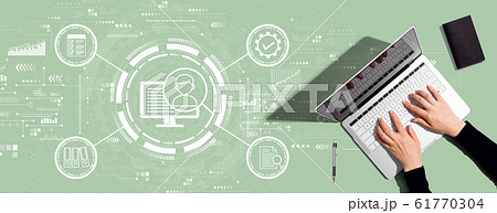 Document management system concept with person using laptop computer 61770304