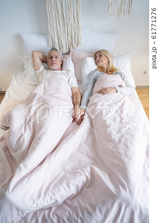 Waking up in the morning and holding hands stock photo 61771276