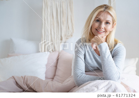 Confident smiling woman in the morning stock photo Confident smiling woman in the morning stock photo 61771324