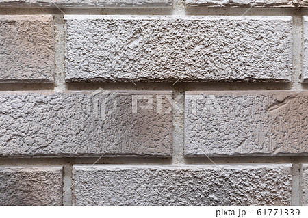 close-up of a light gray brick wall 61771339