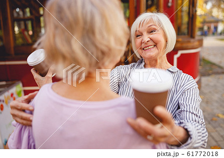 Woman meeting her friend in the park Woman meeting her friend in the park 61772018