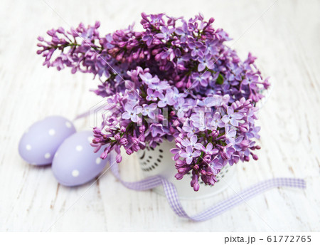 easter eggs and fresh lilac flowers 61772765