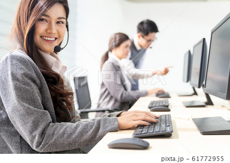 Smiling call Center working Smiling call Center working 61772955