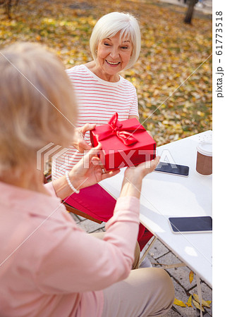 Woman celebrating her birthday with her friend 61773518