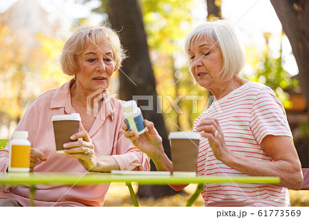 Enthusiastic friends discussing their new medical product Enthusiastic friends discussing their new medical product 61773569