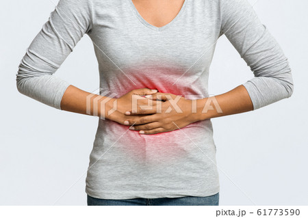 Close up of african woman having menstrual abdominal pain 61773590