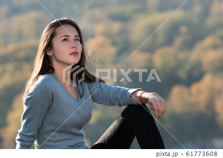 Portrait of a beautiful pensive girl outdoors. Portrait of a beautiful pensive girl outdoors. 61773608