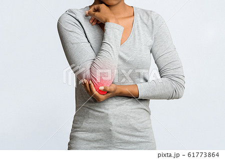 Black woman having acute pain in elbow joint Black woman having acute pain in elbow joint 61773864