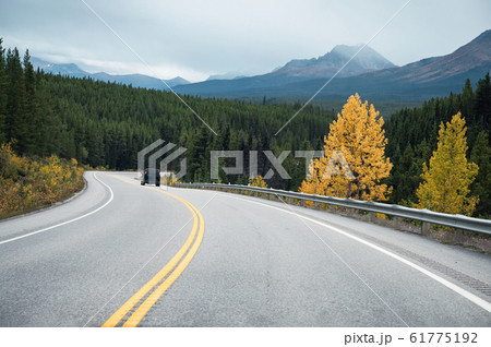 Road trip with rocky mountains in autumn forest at Road trip with rocky mountains in autumn forest at 61775192