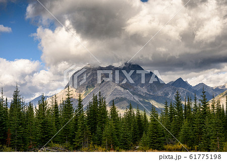 Commercial Helicopter flying with rocky mountains Commercial Helicopter flying with rocky mountains 61775198