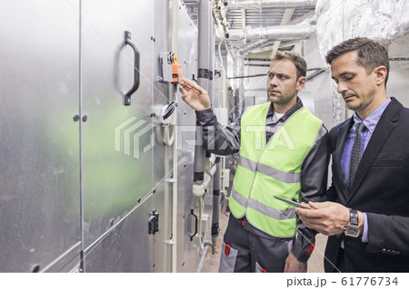 Electrician engineers in electical cabinet control 61776734