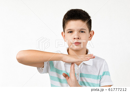 child boy in t-shirt making stop gesture 61777212