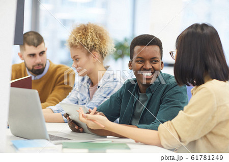 Cheerful Young People Studying in Library 61781249