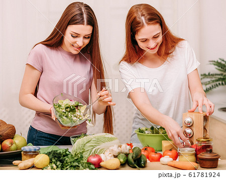 family unity cooking leisure sisters salad kitchen 61781924