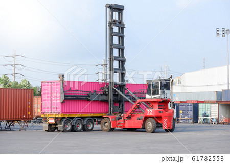 Container handlers are loading containers into Container handlers are loading containers into 61782553