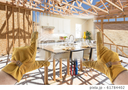 Male Contractor Hands Framing Completed Section of Construction Male Contractor Hands Framing Completed Section of Construction 61784402