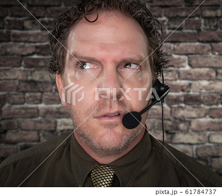 Unfriendly Confused Businessman with Frowning Face 61784737