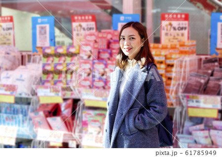 Asian Women shopping at the supermarket. Asian Women shopping at the supermarket. 61785949