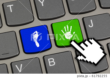Printout of hand and foot on computer keys 61792255