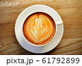 cup of the latte art coffee with warm light 61792899