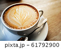cup of the latte art coffee with warm light 61792900