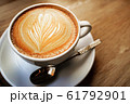 cup of the latte art coffee with warm light 61792901