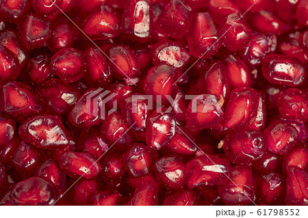 Ripe red pomegranate seeds close up, to view , 61798552