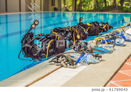 Equipment for diving is on the edge of the pool, ready for a lesson 61799040