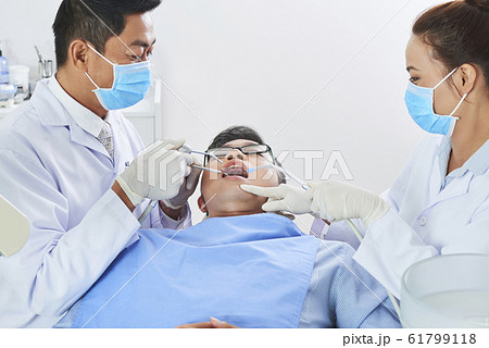 Two Asian Dentists Working Two Asian Dentists Working 61799118