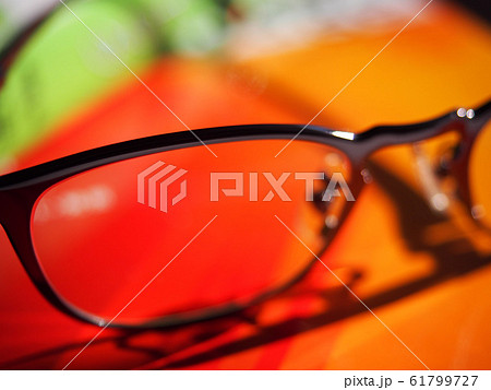 Glasses on Reference Book with Colorful Cover 61799727