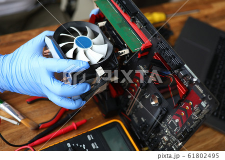 Male hand in blue protective gloves repair and upgrade 61802495