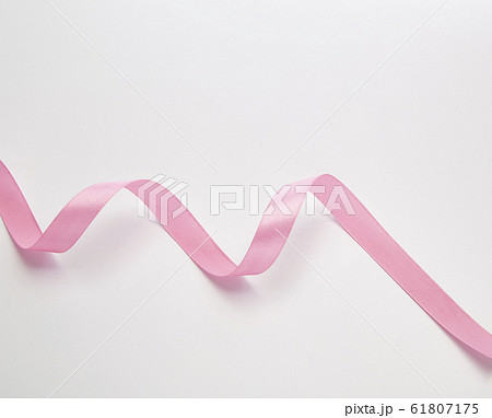 Pink curly ribbon isolated on white Pink curly ribbon isolated on white 61807175