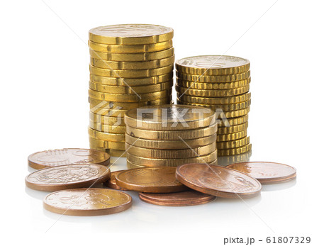 Stacked coins isolated Stacked coins isolated 61807329